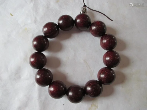 A string of ZITAN WOOD BEADS BRACELET