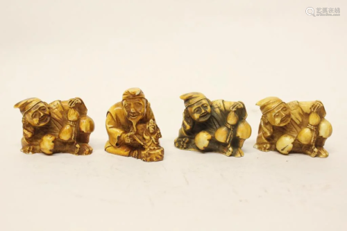 Four Carved Figurines