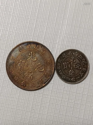 TWO CHINESE OLD SILVER COINS