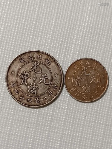 TWO CHINESE OLD SILVER COINS