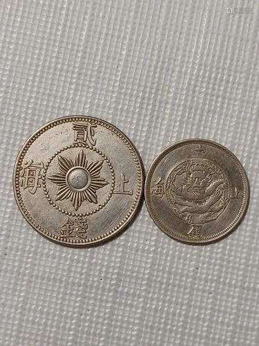 TWO CHINESE OLD SILVER COINS