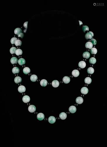 A JADEITE BEAD NECKLACE