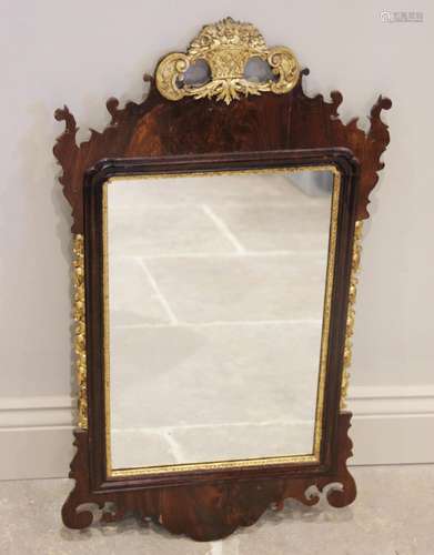 A George III mahogany fret work wall mirror, the giltwood ba...