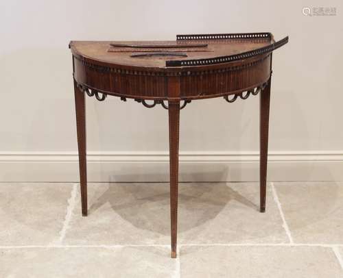 An early 19th century mahogany demi lune hall table, the bow...