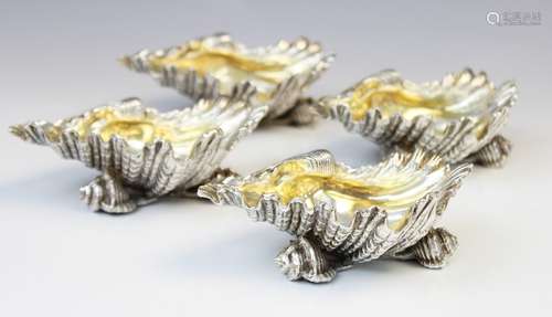 A set of four silver plated shell salts by Elkington & Co, e...