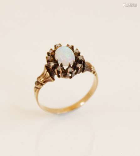 An early 20th century opal and diamond cluster ring, compris...