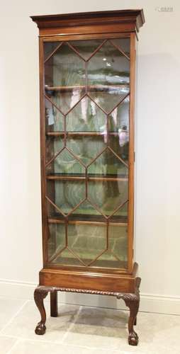 An early 20th century Chippendale revival mahogany display c...