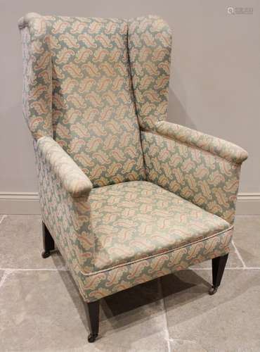 A late 19th century/early 20th century wing back armchair, c...