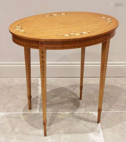 An Edwardian Sheraton revival satinwood occasional table, th...