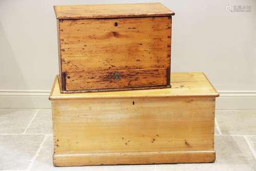 A Victorian pine blanket chest, the hinged cover opening to ...