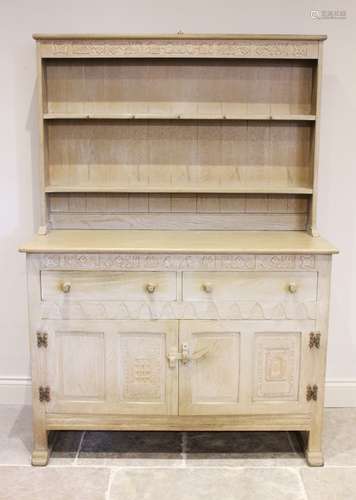 A mid 20th century limed oak Welsh dresser, the high back wi...