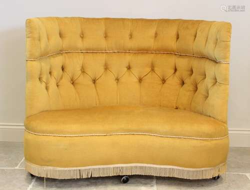 An early 20th century button back love seat, upholstered in ...