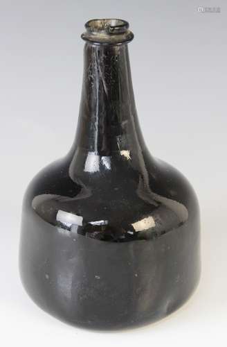 An 18th century olive green English wine bottle, of mallet s...