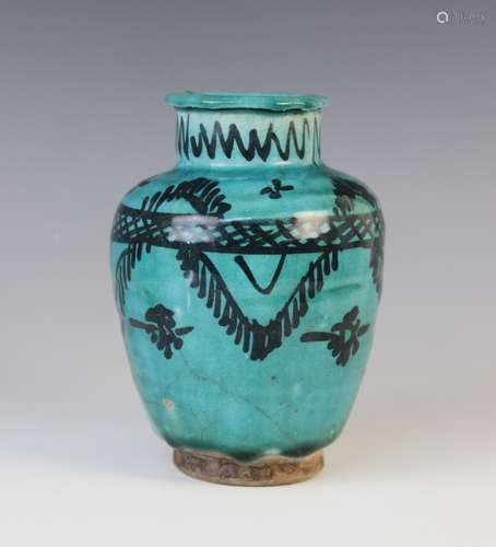 A Persian Kashan turquoise glazed pottery vase, the high sho...