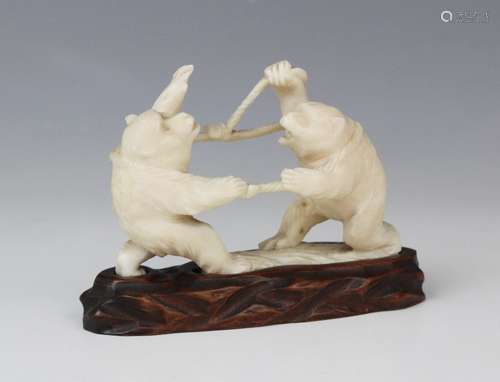 A Japanese carved ivory okimono, Meiji period (1868-1912), m...