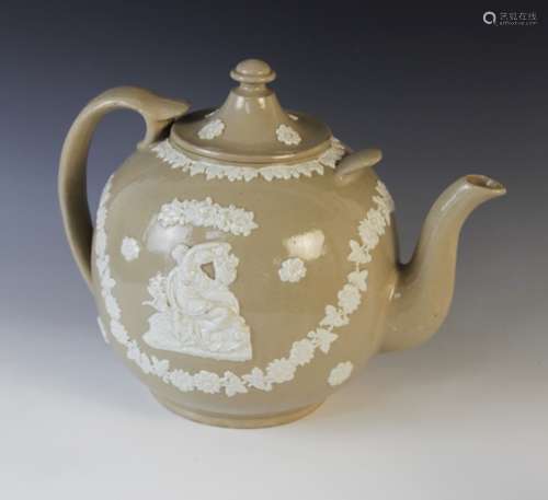 A salt glazed stoneware teapot and cover of large proportion...