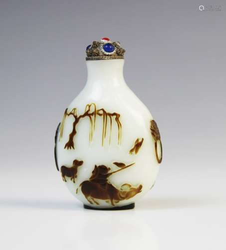 A Chinese carved Peking Glass snuff bottle, relief carved wi...