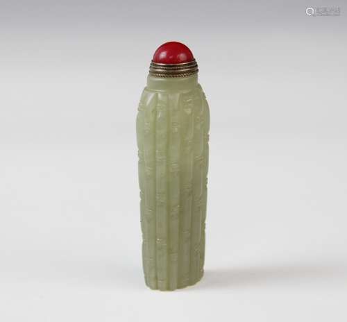 A Chinese carved jade snuff bottle, of narrow cylindrical fo...