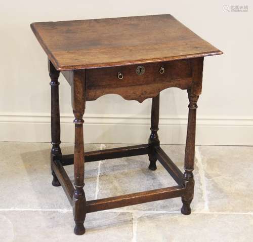 An 18th century oak side table, of cottage proportions, the ...