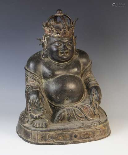 A large 18th/19th century bronze buddha, modelled seated and...