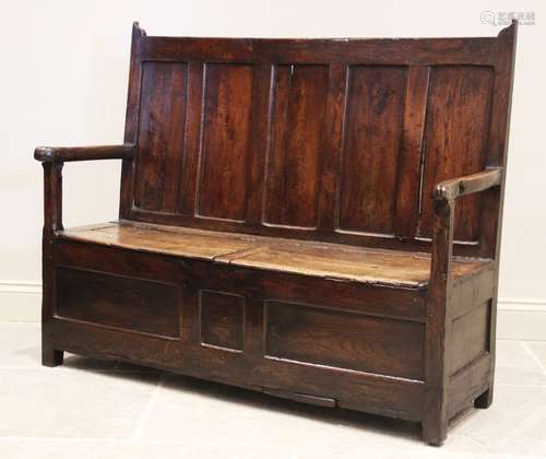 A 17th century oak box settle of cottage proportions, the fi...