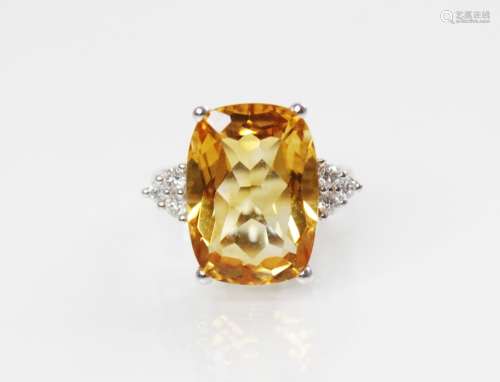 A citrine and diamond 18ct gold ring, the central rectangula...