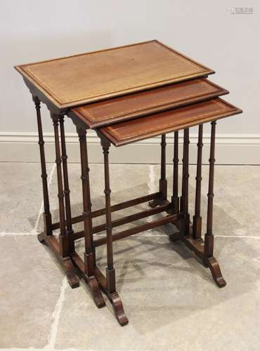 An Edwardian nest of three mahogany and satinwood cross band...