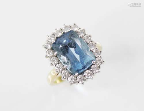 An aquamarine and diamond 18ct gold cluster ring, the centra...