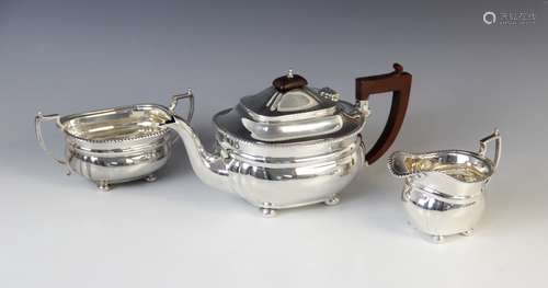 A George V three-piece silver tea service by Adie Brothers L...