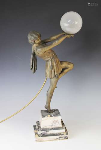 An Art Deco patinated spelter table lamp, early 20th century...