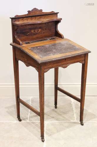 A late 19th century ladies rosewood writing desk, the raised...