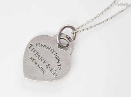 A Tiffany & Co silver heart pendant marked 'Please return to...