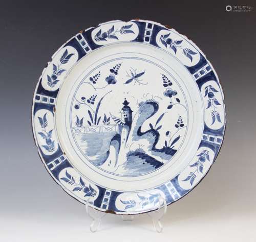 A Delft ware charger, 18th century, the tin glazed earthenwa...