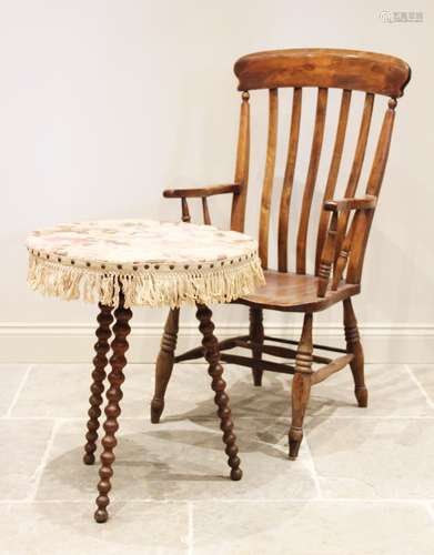 A Victorian elm and beech wood Windsor farmhouse elbow chair...