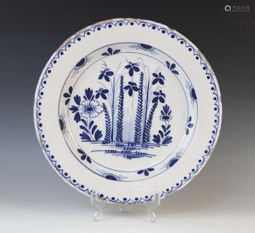 A Delft ware charger, 18th century, the tin glazed earthenwa...