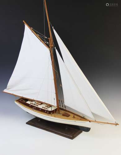 A vintage model of a yacht in full sail, probably mid 20th c...
