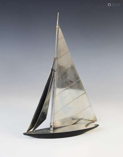 An Art Deco chromed metal model of a yacht in full sail, the...