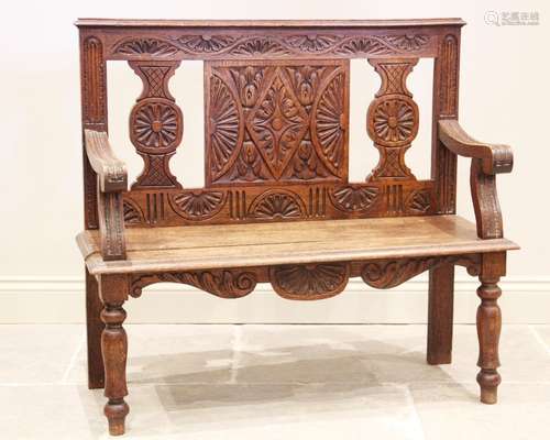 A 19th century and later constructed oak settle, the rail ba...