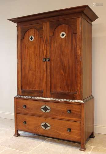 An early 20th century mahogany Arts & Crafts linen press, in...