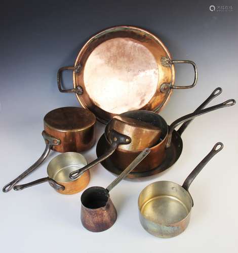 A selection of 19th century and later copper pans comprising...