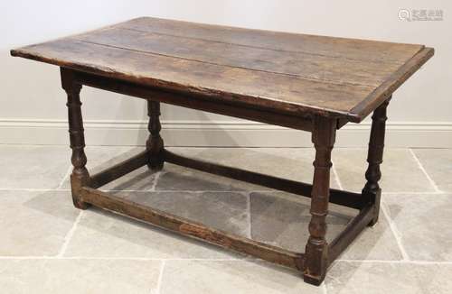 A 17th century and later oak table, the cleated three plank ...