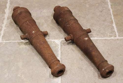 A pair of 19th century cast iron canon barrels, each of typi...