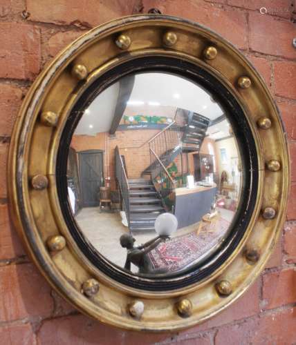 A Regency style circular gilt wood wall mirror