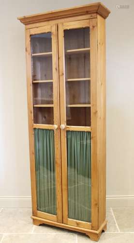 A Victorian and later constructed pine glazed bookcase, the ...