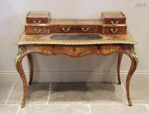 A Louis XVI style figured walnut and marquetry bureau plat, ...