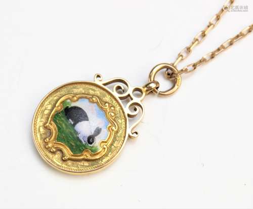 A 9ct yellow gold and enamel Dutch rabbit pendant, the circu...