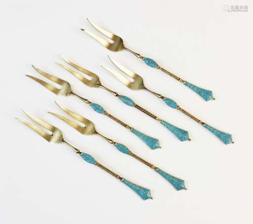 A set of six Danish silver gilt blue enamel pickle forks by ...