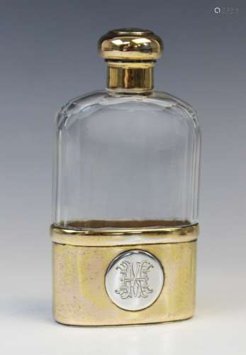 An Edwardian silver gilt and glass hip flask by Finnigans Lt...