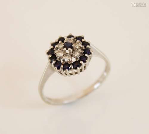 An 18ct gold sapphire and diamond floral cluster ring, compr...