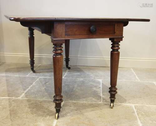 A mid 19th century Pembroke table, the rectangular drop leaf...